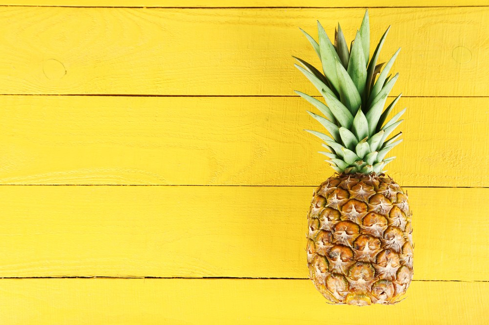 Pineapple on yellow boards.
